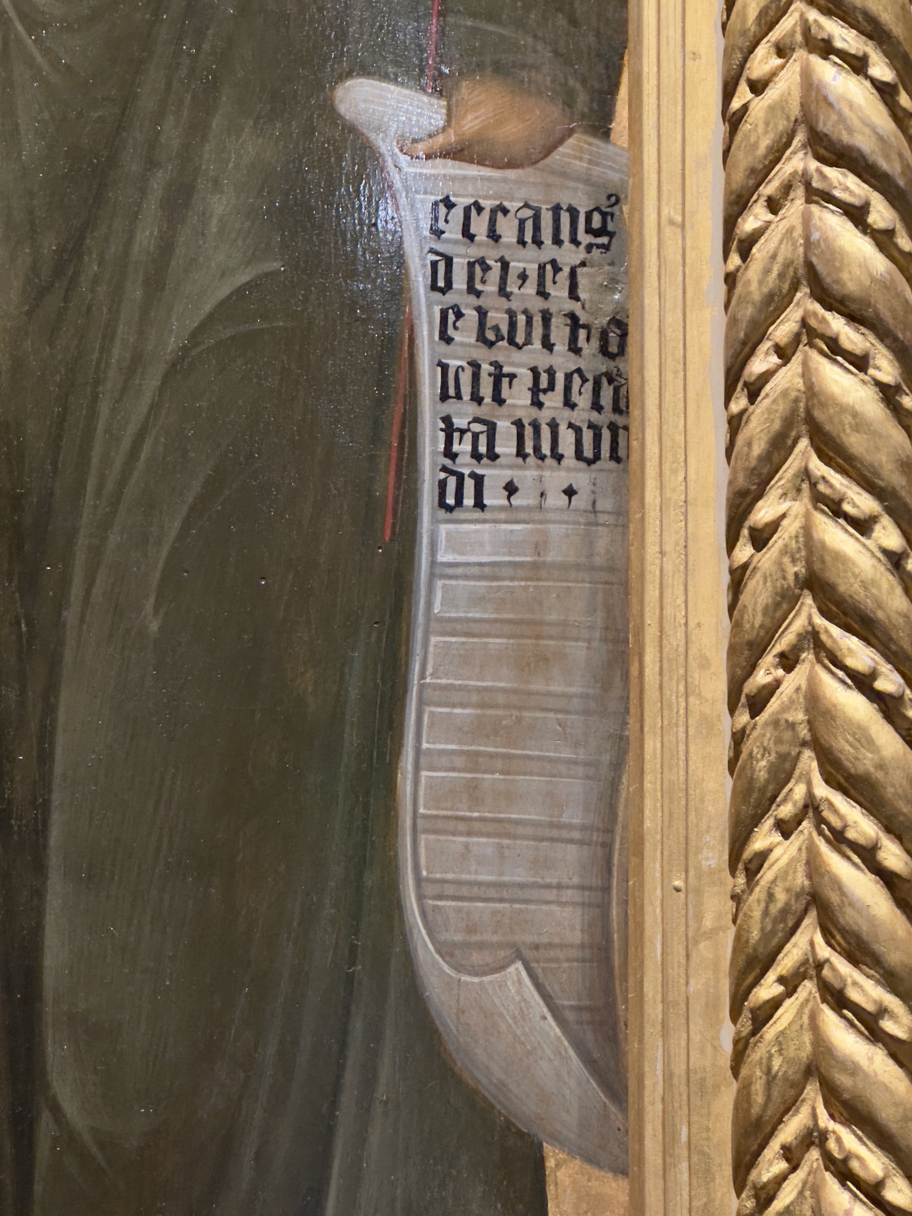 close up of scroll held by John the Baptist